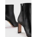 Leather ankle boots with half-moon heel